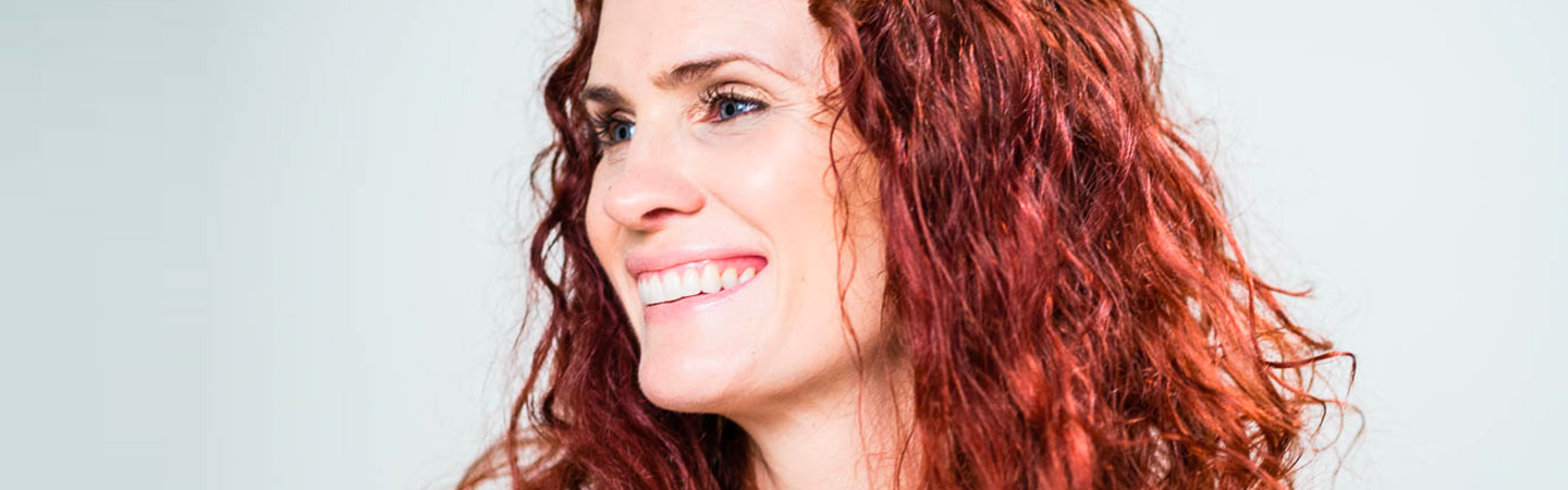 Profile view of Janelle smiling.